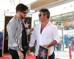 LOS ANGELES  AUG 22, Adam Lambert, Simon Cowell at the Simon Cowell Star Ceremony on the Hollywood Walk of Fame on August 22, 2018 in Los Angeles, CA photo