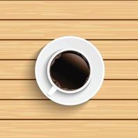Coffee cup on wooden table top view.