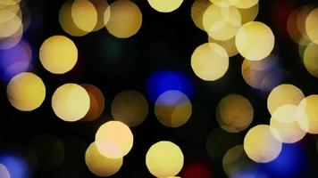 Blurred bokeh and outdoor illuminated multicolored decorative lighting in night festival time video