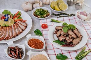 Grilled Liver Slices with, carrots, chili, spring onions, and mint. photo