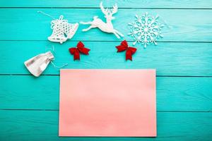 Christmas accessories and copy space on blue wooden background. Top view photo