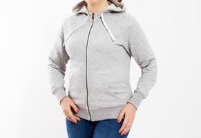 Woman in hoodie sweater on light background. Space for design mock up photo