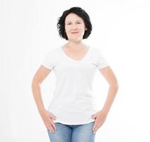 front view pretty middle age woman in white t-shirt on white background. Mock up for design. Copy space. Template. Blank photo