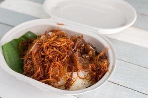 Fried Pork on steamed glutinous rice photo