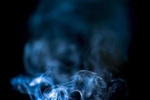 abstract background of smoke or fog on black background photo