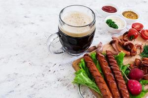 Beer with sausages and spices photo