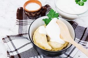 Delicious dumplings with cabbage on white background photo