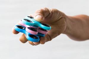 Three hand spinners in the fingers.
