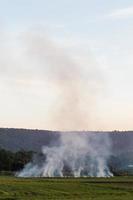 Smoke stubble burning mountain. photo