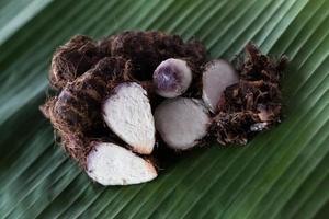 Boiled taro, banana leaves. photo