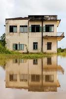 Abandoned building with water reflection. photo