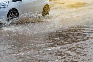 Wheels car sped through flooded. photo