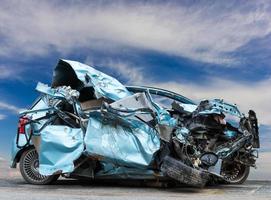 Cars demolished and sky. photo