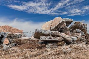 Concrete debris with sky clouds. photo