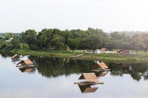 Bamboo raft with vetiver roof on the lake. photo