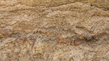 Soil below the gravel road. photo