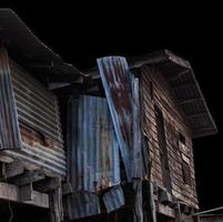 Old wooden house is damaged. photo