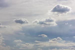 Fluffy clouds backlit scenery. photo