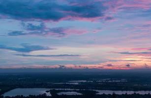 Purple early morning sky above the countryside. photo