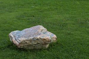 Large stones placed on the lawn. photo
