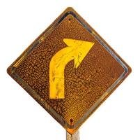 Isolates rusted sign and turn right. photo