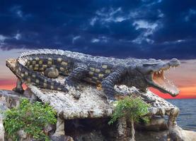 Crocodile statue Cloudy. photo