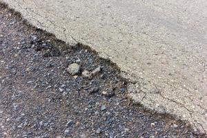 Asphalt road surface crack ruins. photo