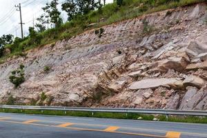 Rock cliffs with paved roads. photo