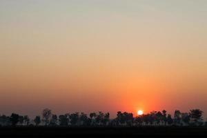 Orange sunrise over the countryside. photo