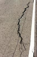 Asphalt broken white line. photo