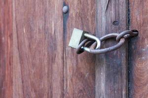 Lock key on old wooden door. photo