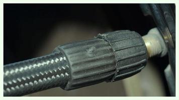 Inflating tire. man hand open valve cap and inflate car tyre before driving. video