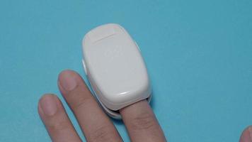 Oximeter usage. Finger pulse oximeter used to measure pulse rate and oxygen levels. video