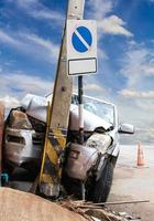 Cars collided with a power pole. photo