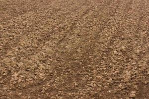 Background soil plowing wetlands. photo