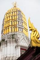 Golden pagoda with Kanok. photo