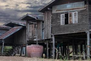 Old wooden house with jar. photo