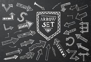 Hand drawn arrow icons set on black chalk board. vector
