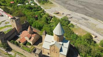 Aerial flight over Ananuri castle complex with beautiful town of Ananuri in background. Travel destination Georgia video