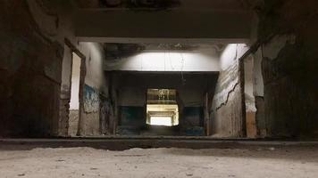 Static view to steam coming out of bath pool underground in Tsqaltubo abandoned spa building. video