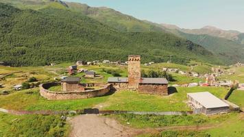 Aerial view of Lamaria monastery surrounded by beautiful nature in Ushguli village. Unesco world heritage sites in Georgia