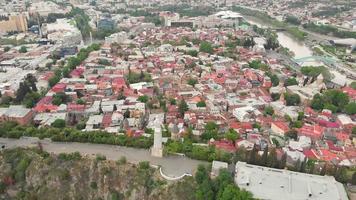 Aerial scenic view of Mother of Georgia statue over Tbilisi city panorama. Georgia history and travel concept