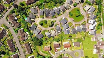 Descending view down to grey house roofs, yards and green nature landscape in french neighborhood in Saint-lo, France video