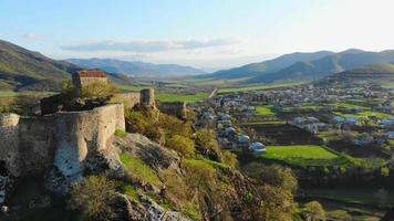 Aerial panning view historical Kveshi fortress wall ruins with scenic landscape panorama in southeastern Georgia video