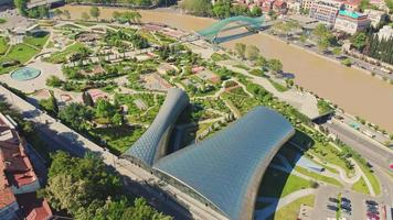 Aerial fly over futuristic Rike park in Tbilisi. Sightseeing Tbilisi and extraordinary parks concept