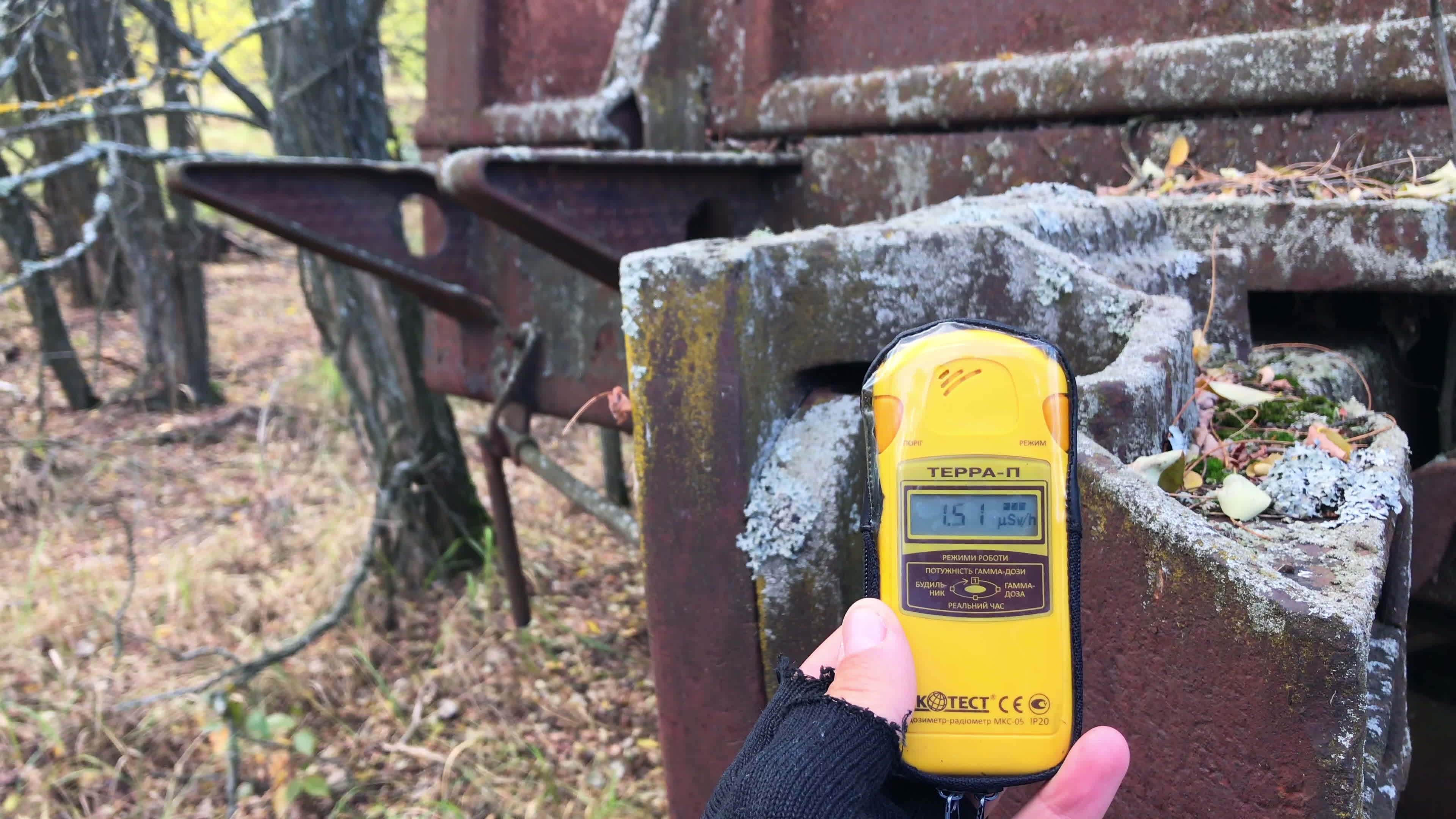 Chernobyl, Ukraine, 2019 Close up of male hand holding Geiger counter by the metal surface of