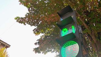 Traffic pedestrian light change from red to green outdoors close up view video