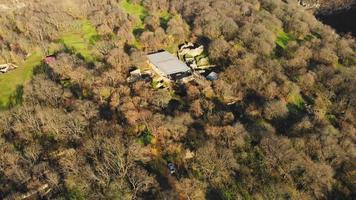 Fly over Dmanisi museum reserve building with valley panorama in Georgia. Famous 1,8 billion years old hominins fossils discovery archeological site video