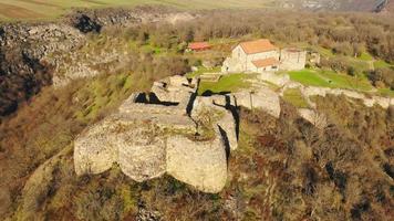 Fly over Dmanisi museum reserve building with valley panorama in Georgia. Famous 1,8 billion years old hominins fossils discovery archeological site video