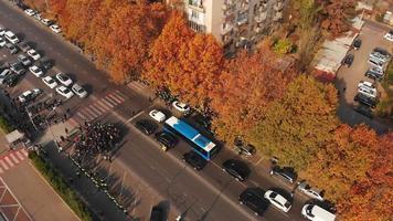 Tbilisi, Georgia 10th november, 2021 - Aerial top down view Police officers surround crowd of aggressive protestors in street in public anti-government protest video